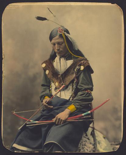 Photo of an Indian with bow and arrows.